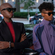 Black Panther's Okoye and Shuri in civilian clothes and sunglasses.